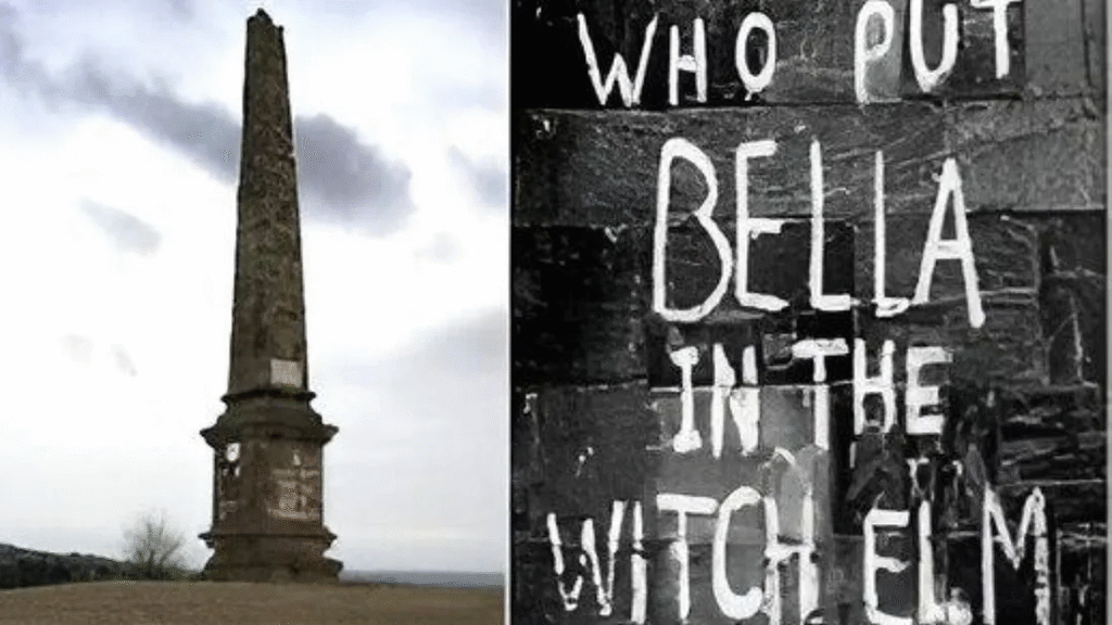Black and white image showing the “Who Put Bella in the Wych Elm?” graffiti alongside a stone monument near Hagley Wood, associated with Britain’s famous unsolved wartime mystery.