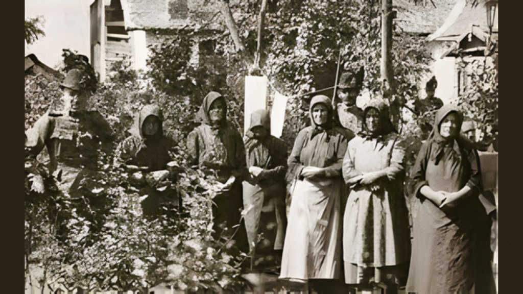 Historic black-and-white photograph of rural Hungarian women standing together outdoors in the early 20th century, representing village life during the time of the Angel Makers of Nagyrév.